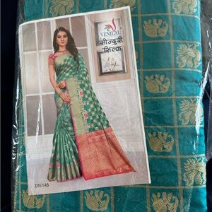 Venilal Teal and Gold Saree